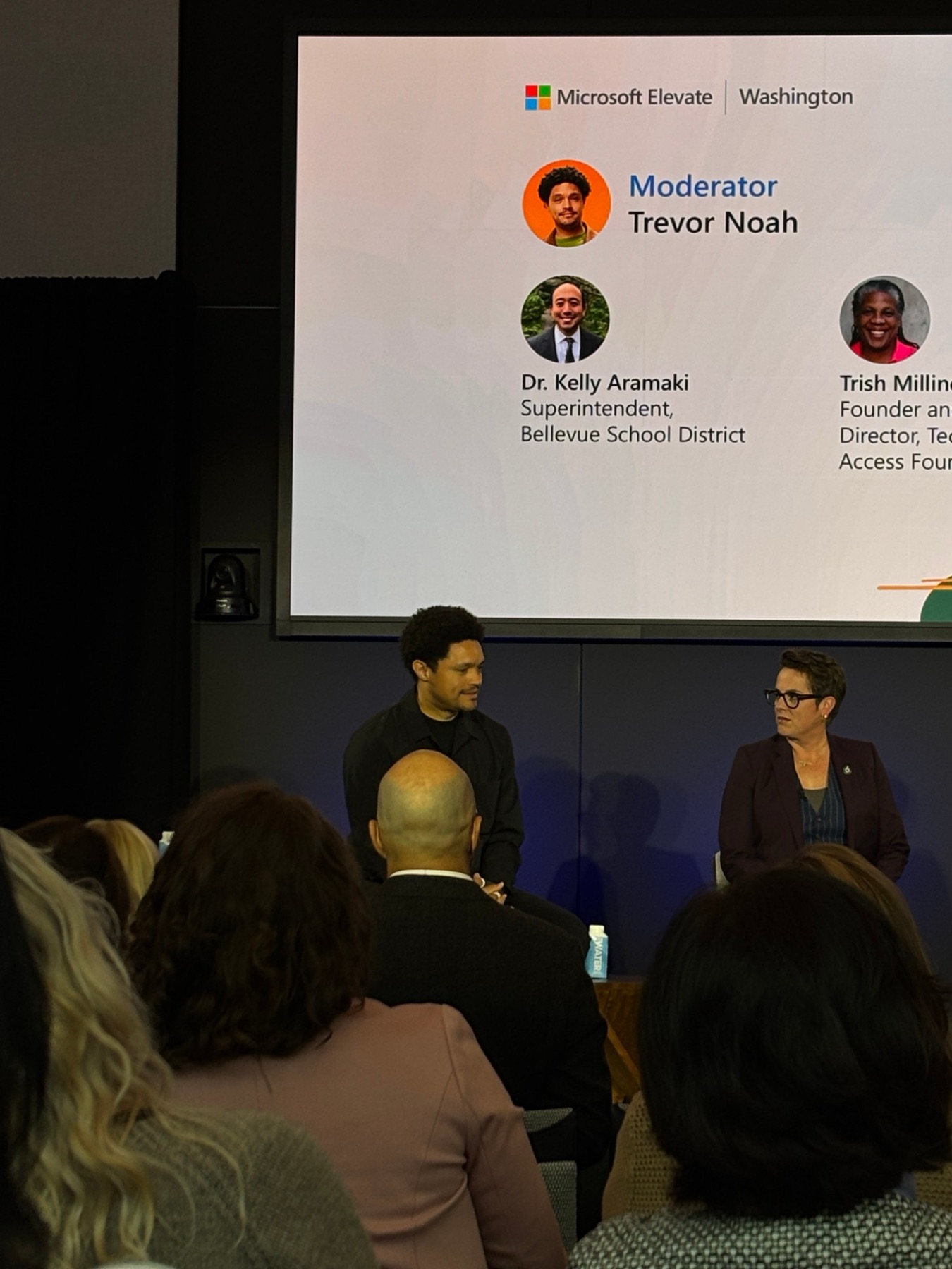 Trevor Noah moderating the panel with Bellevue School District superintendent Dr. Kelly Aramaki.